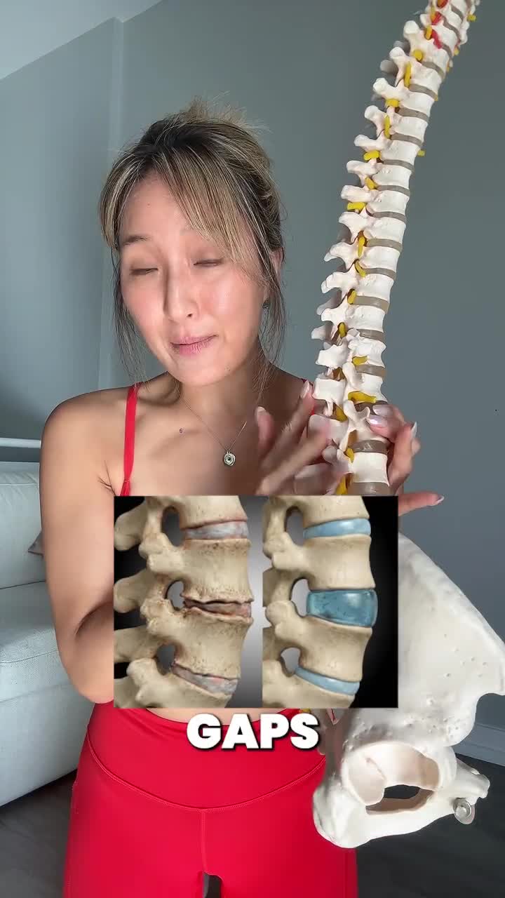 Jenna holding a model of the spine
